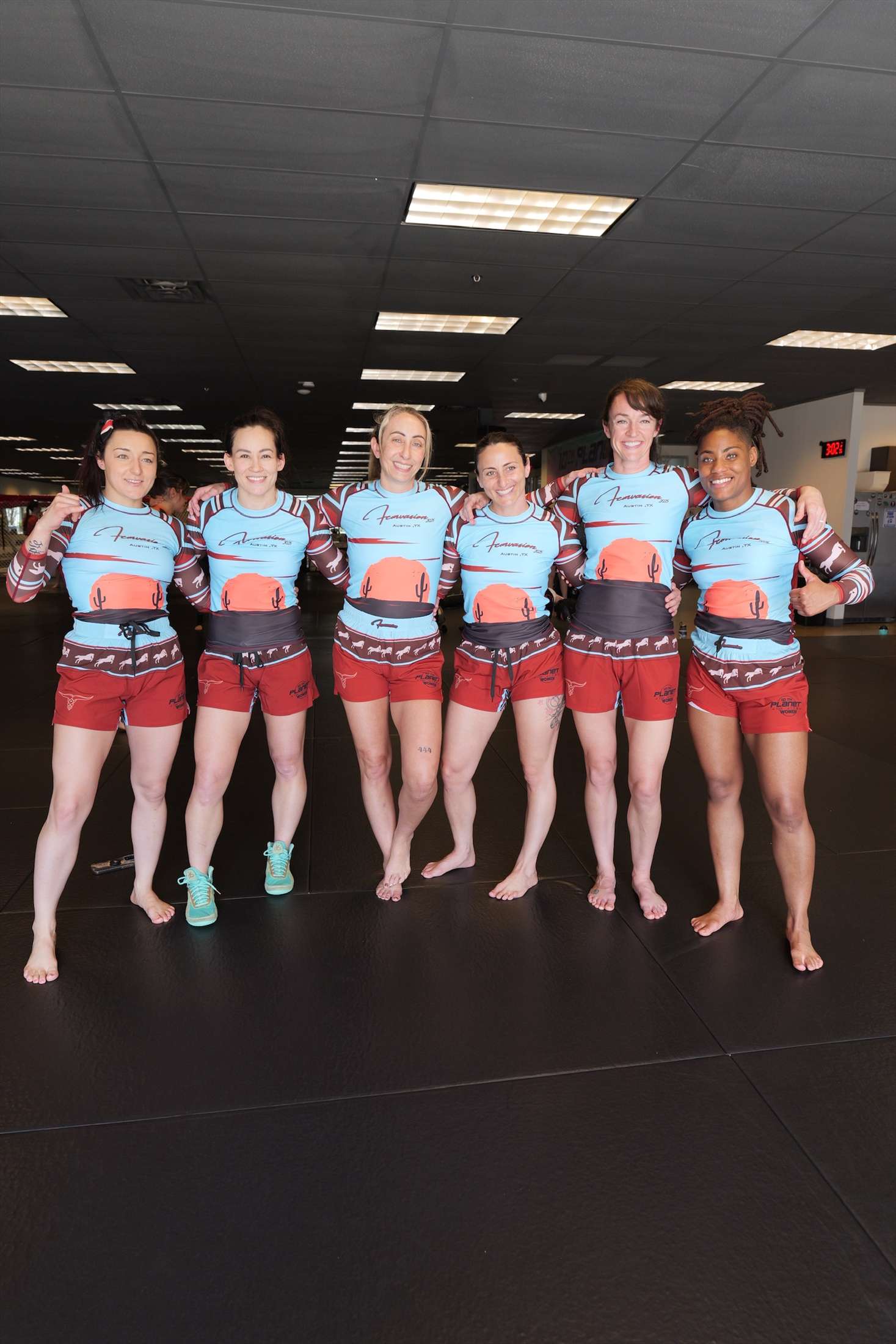 Women wearing matching Femvasion training gear